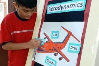 Student labelling the forces of drag, lift, gravity and thrust related to Aerodynamics.