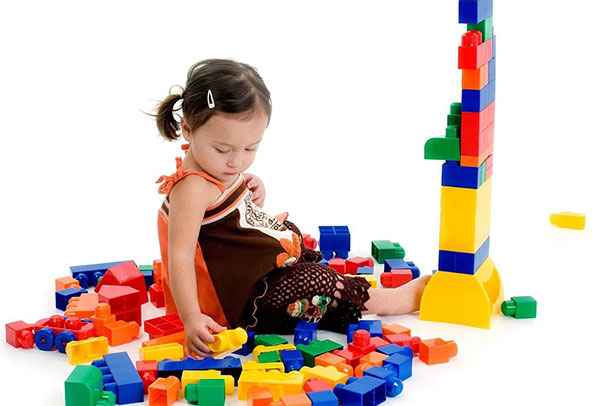 kid playing with blocks