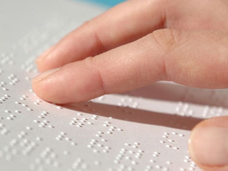 Disability rights activist gifts Braille script literature to University of Jammu
