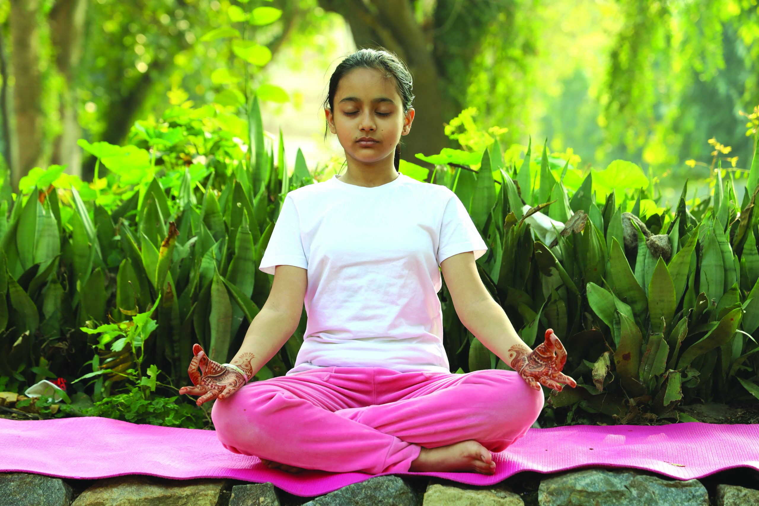 indian child doing yoga