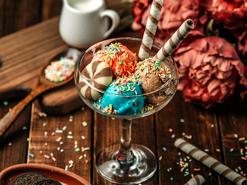 ice cream balls topped with cookies and candies