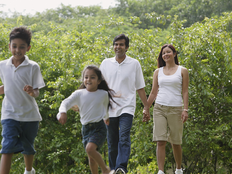 A,Family,Walk,Together,In,The,Park