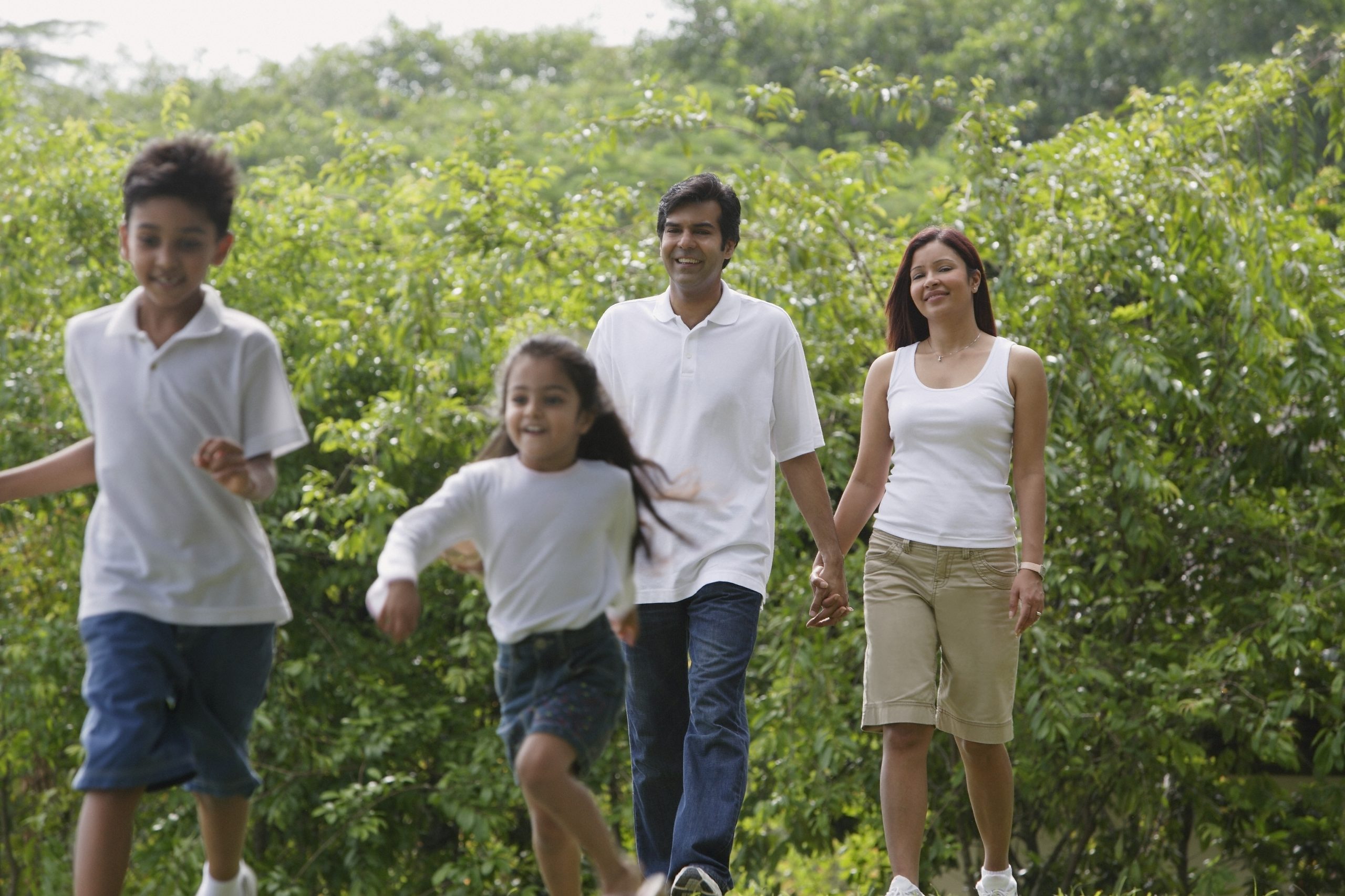 A,Family,Walk,Together,In,The,Park