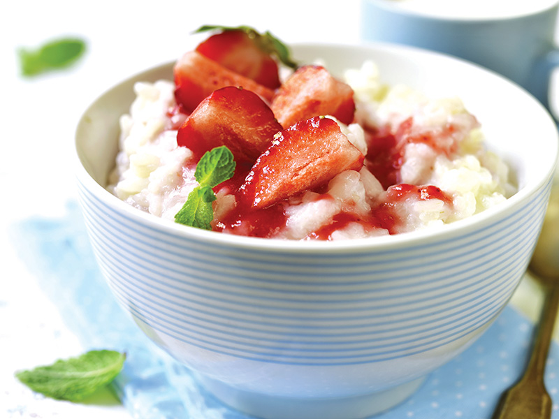 Milk,Rice,Porridge,With,Strawberry,On,A,Light,Background.