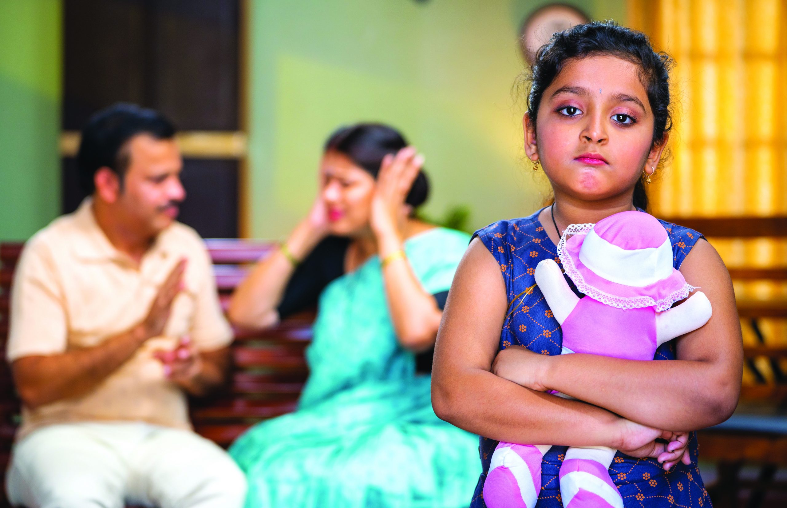 Rack,Focus,Shot,Of,Sad,Kid,With,Doll,In,Front