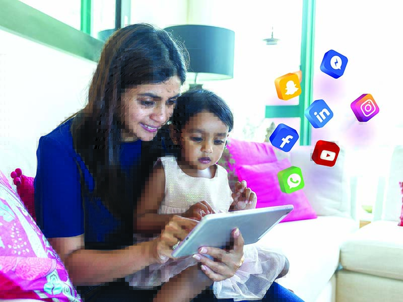 stock-photo-litlle-girl-play-tablet-pc-with-her-mother-at-home-3