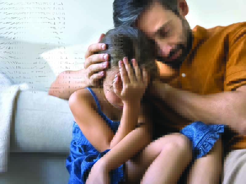 Close,Up,Of,Caring,Dad,Comforting,His,Little,Daughter,,Coping