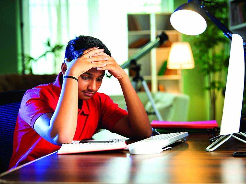 Stressed,Asian,Indian,Teenage,School,Boy,Learning,Virtually,At,Home,